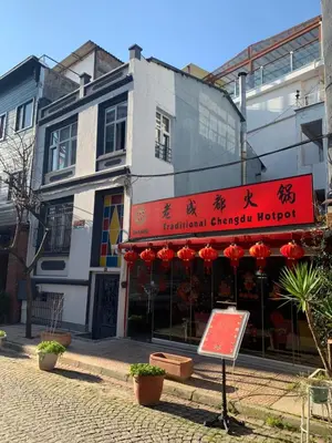 a building with a red sign in front of it at Blue Suites by V in Istanbul