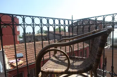 a bench sitting on top of a balcony at Tom Square Boutique Hotel in Istanbul