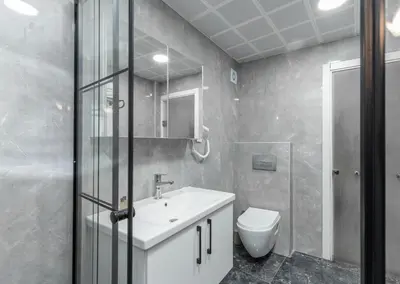 a bathroom with a white sink and a toilet at Sirkeci Grand Family Hotel & SPA in Istanbul