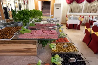 a buffet with many different types of food on display at DİNAR HOTEL in Istanbul