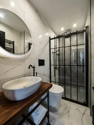 a bathroom with a sink and a toilet and a mirror at Blu Hotel in Istanbul