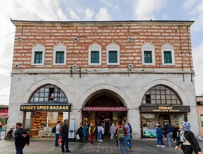 a group of people standing outside of a brick building at Blu Hotel in Istanbul