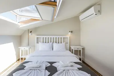 a bedroom with a large white bed with two pillows at Hotel Miro Mansion Old City in Istanbul
