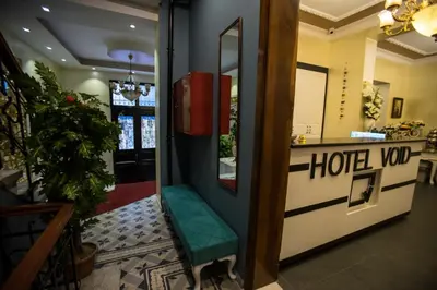 a door to a hotel room with a green bench at The Void Hotel in Istanbul