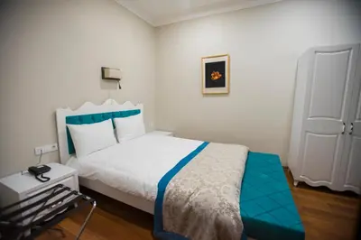 a bedroom with a bed with a blue and white at The Void Hotel in Istanbul