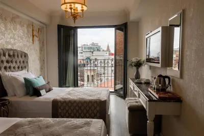 a hotel room with two beds and a window at Hotel The Pera Hill in Istanbul