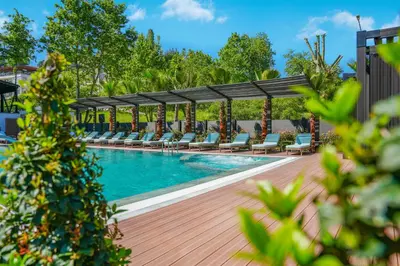 a swimming pool with lounge chairs and a pavilion at Vital Thermal Hotel & SPA in Termal