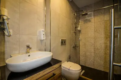 a bathroom with a sink and a toilet at Hit Suites Avcilar Hotel in Avcılar