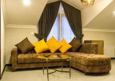 a living room with a couch and a table at Hit Suites Avcilar Hotel in Avcılar