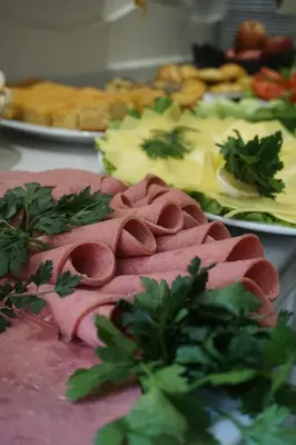 a table with plates of food with meat and vegetables at Hotel Coliseum in Istanbul