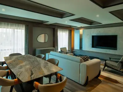 a living room with a table and a couch at Mercure Istanbul Altunizade in Istanbul