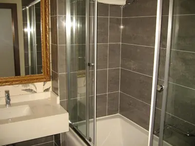 a bathroom with a shower and a sink at Termal Elit Hotel in Gokcedere