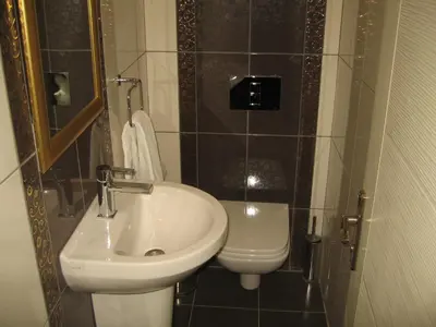 a bathroom with a sink and a toilet at Termal Elit Hotel in Gokcedere