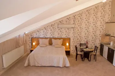 a bedroom with a bed and a table with chairs at The Bosphorus House in Istanbul