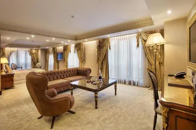a living room with a couch and a table at Ottoman's Life Hotel Deluxe in Istanbul
