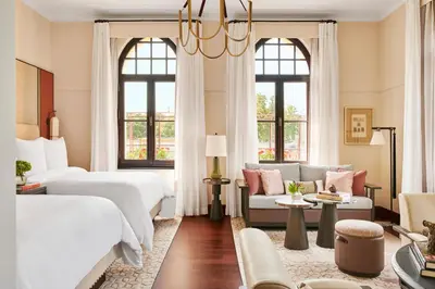 a hotel room with two beds and a couch at Four Seasons Hotel Istanbul at Sultanahmet in Istanbul