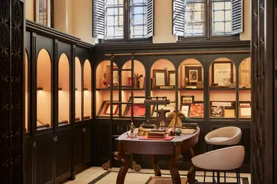 a room with a table and two chairs and windows at Four Seasons Hotel Istanbul at Sultanahmet in Istanbul