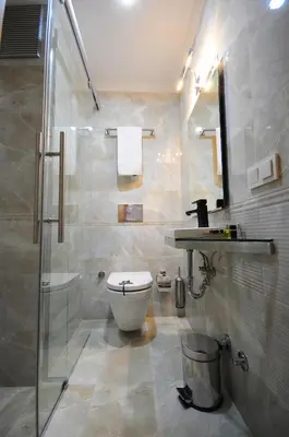 a bathroom with a toilet and a shower and a sink at Ottopera Hotel in Istanbul