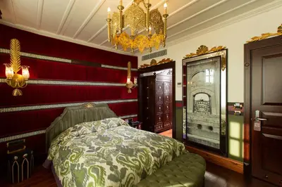 a bedroom with a bed and a chandelier at Premist Hotels Sultanahmet in Istanbul