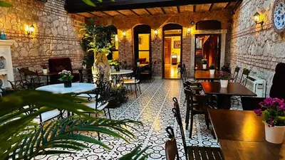 a restaurant with tables and chairs in a room at Celine Hotel - Ottoman Mansion in Istanbul