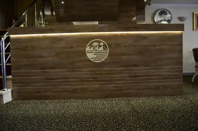 a set of wooden stairs with a sign on it at Mekke Hotel Istanbul in Istanbul