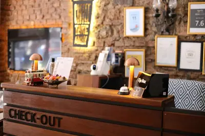 a cash counter in a restaurant with a sign that says check out at New Pera in Istanbul