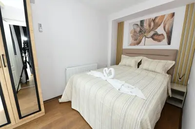 a bedroom with a bed with a white bow on it at Sea Moon Hotel in Istanbul