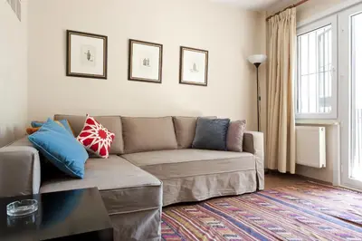 a living room with a couch with pillows on it at Aslan Apartments in Istanbul