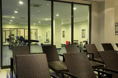 an empty waiting room with chairs and a treadmill at The Loft House Taksim in Istanbul