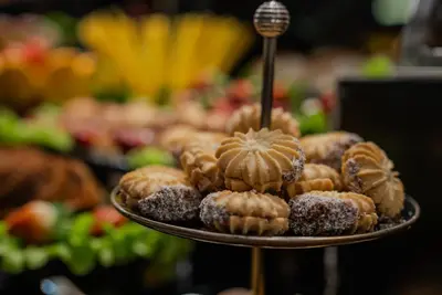 a pile of donuts on a plate in a store at BEST GARDEN HOTEL in Istanbul