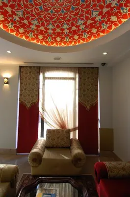 a living room with a couch in front of a window at Sultan Mehmed Hotel in Istanbul