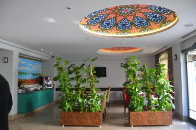 a room with plants and a colorful ceiling at Sultan Mehmed Hotel in Istanbul