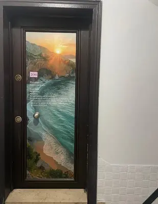 a door with a picture of a beach at ivy hostel cafe in Istanbul