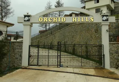 a gate with a sign that reads original hills at Orchid Hills - heated swimming pool in Sapanca