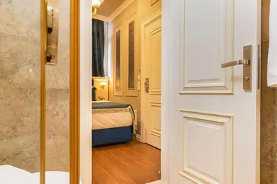a door leading into a room with a bedroom at Begonville 2 Mansion Oldcity in Istanbul