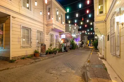 an empty street at night with lights and buildings at Begonville 2 Mansion Oldcity in Istanbul