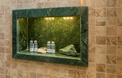 a mirror on a bathroom wall with a shelf at Begonville 2 Mansion Oldcity in Istanbul