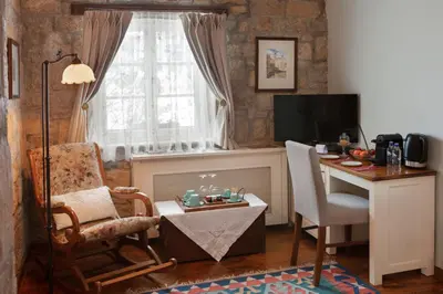 a living room with a desk and a chair and a table at Casa Lavanda Boutique Hotel in Sile