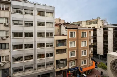 a group of tall buildings in a city at Cihangir Palace Hotel in Istanbul