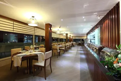 a dining room with tables and chairs in a restaurant at Victory Hotel & Spa Istanbul in Istanbul