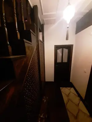 a dark room with a door and a light at Fener sweet in Istanbul