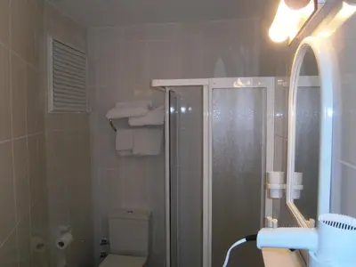 a bathroom with a shower and a toilet at Hotel Nova in Istanbul