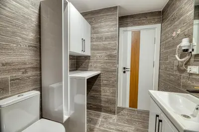 a bathroom with a toilet and a sink at Grisverde Suites in Istanbul
