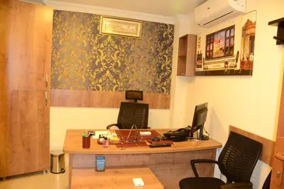 an office with a desk with a computer on it at Şar Apartment Suites in Istanbul