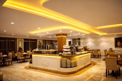 a restaurant with a bar and tables and chairs at Emirtimes Hotel&Spa - Tuzla in Istanbul