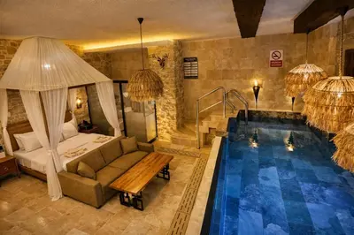 a hotel room with a bed and a swimming pool at Emirtimes Hotel&Spa - Tuzla in Istanbul