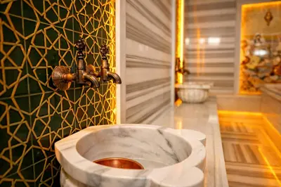 a bathroom with a sink with a fountain at Emirtimes Hotel&Spa - Tuzla in Istanbul
