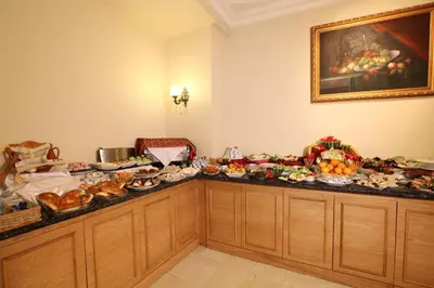 a table with a bunch of food on it at Sirkeci Park Hotel in Istanbul