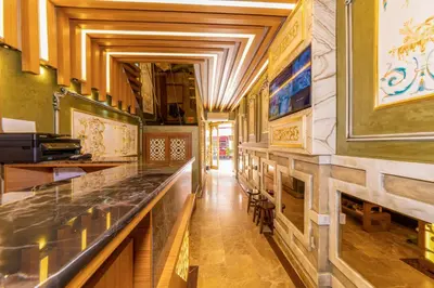a kitchen with a long counter in a restaurant at Golden Sand Hotel in Istanbul