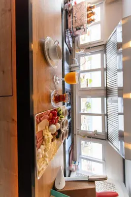 a wall with food in a kitchen with a window at Golden Sand Hotel in Istanbul